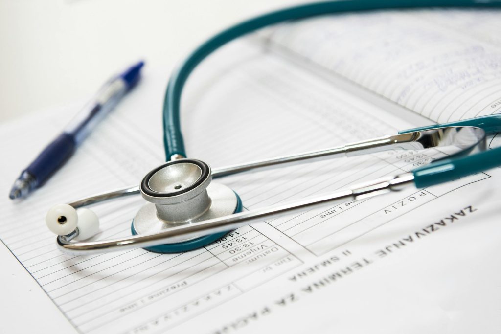 medical appointment doctor healthcare 40568 40568 A stethoscope and pen resting on a medical report in a healthcare setting.