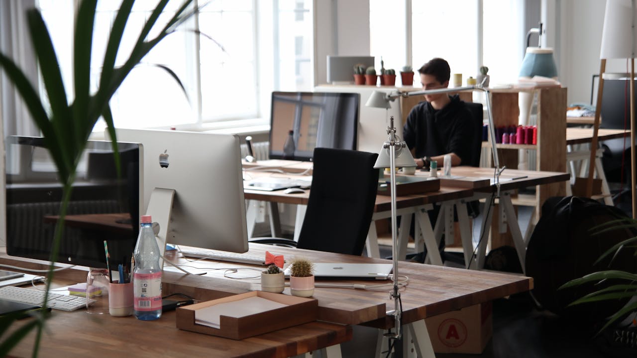 why-choose-us Open-plan office with modern decor and natural lighting, ideal for productivity.